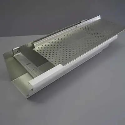 Close-up of perforated aluminum gutter guard showing hole pattern and rigid frame construction
